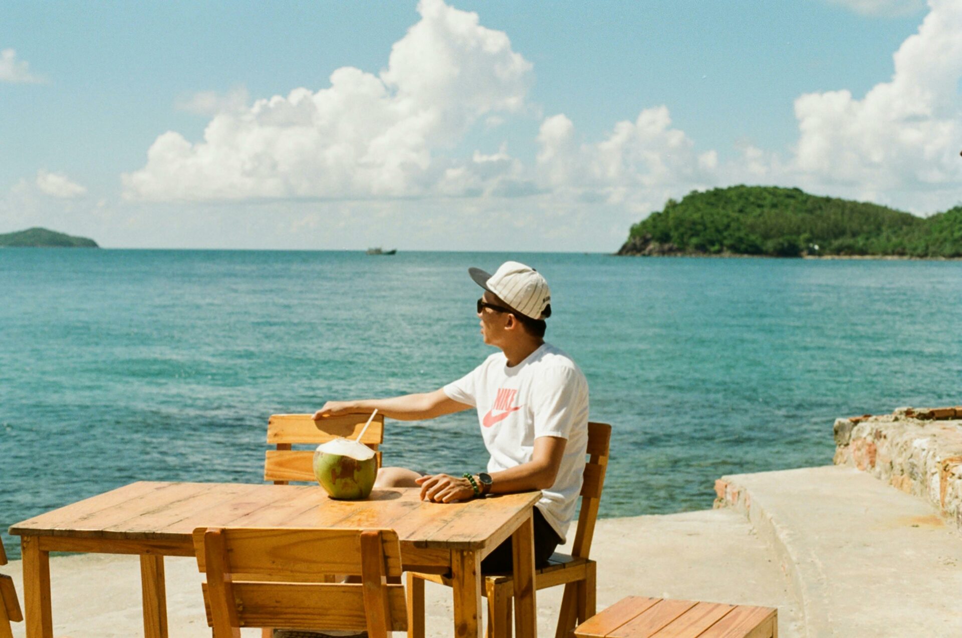 solo traveler sitting seaside