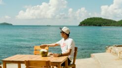 solo traveler sitting seaside